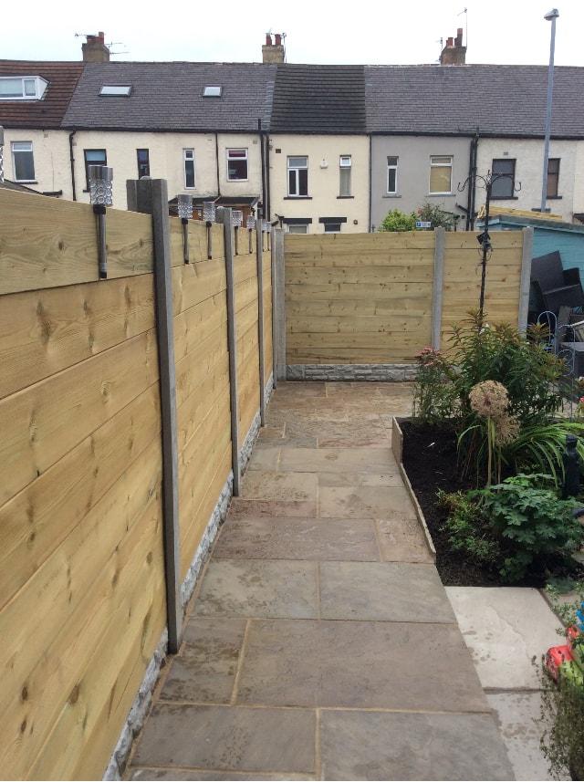 Garden gate entrance with stone wall